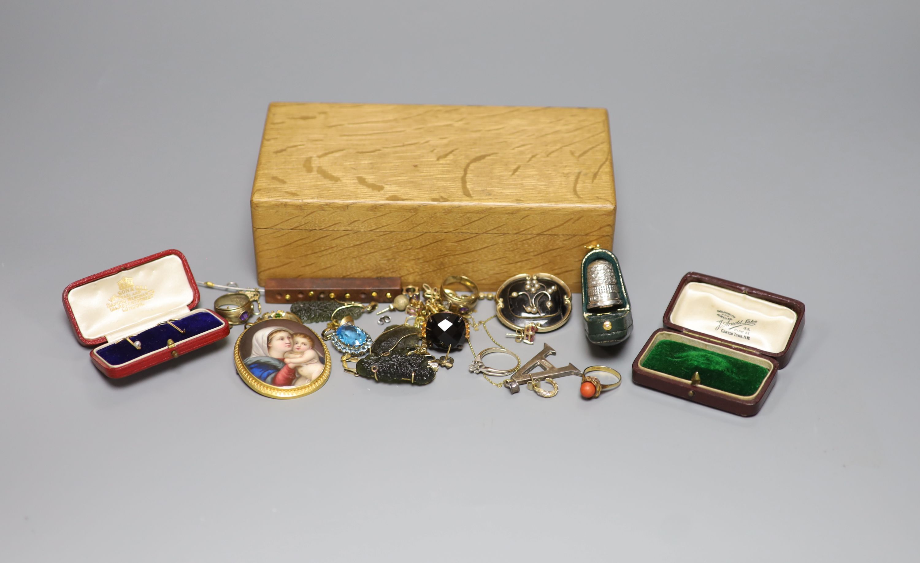 A group of assorted jewellery including two 333 yellow metal dress rings including coral set, a Victorian yellow metal, seed pearl and black enamel mourning brooch, cased silver Charles Horner thimble etc.